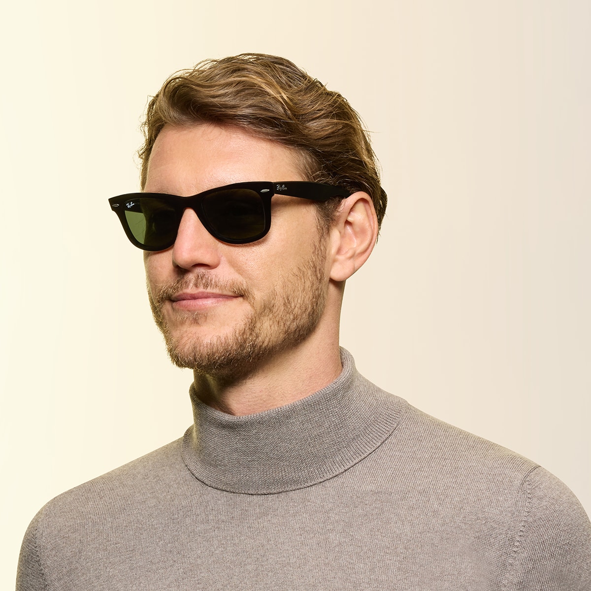 Man wearing Ray-Ban® Original Wayfarer glasses